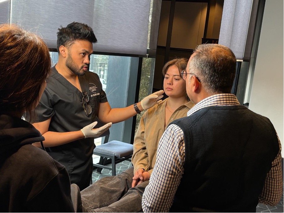 Dr Rakib assessing the lower face during a consultation