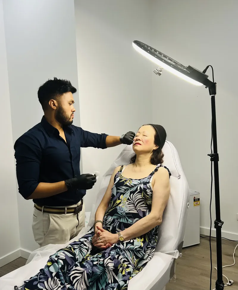 Dr Rakib Uddin treating a patient at Aesthetic Doctors Australia in Kew