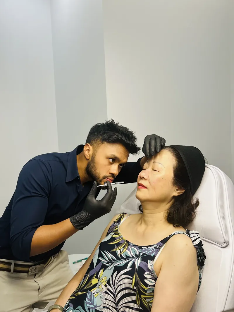 Dr Rakib Uddin performing a skin injectable treatment