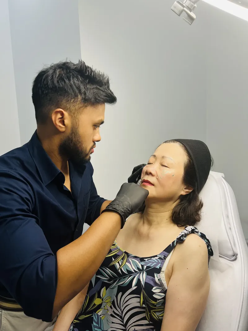 Dr Rakib Uddin performing a wrinkle relaxer treatment